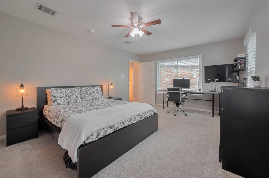 An additional large window enhances the room, inviting even more natural light and completing this bright, airy space.