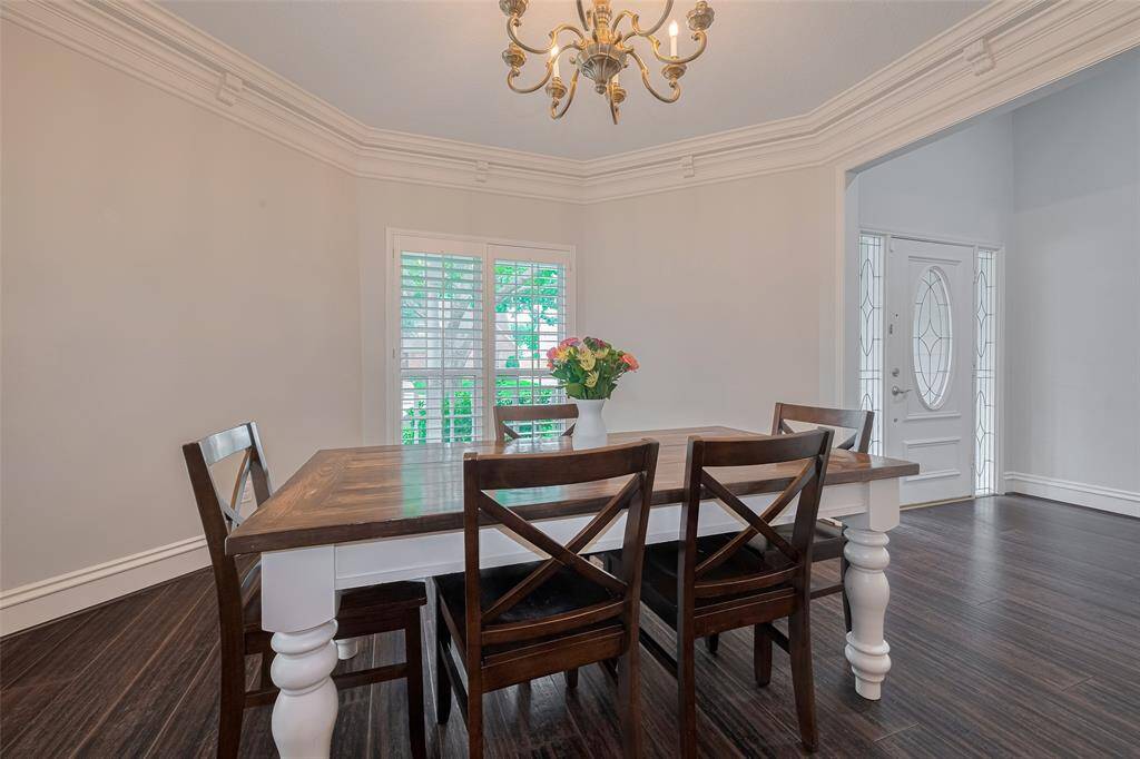 Spacious and inviting, this dining room easily accommodates a large table, chairs, and a china hutch—perfect for hosting gatherings and creating memorable moments with family and friends.