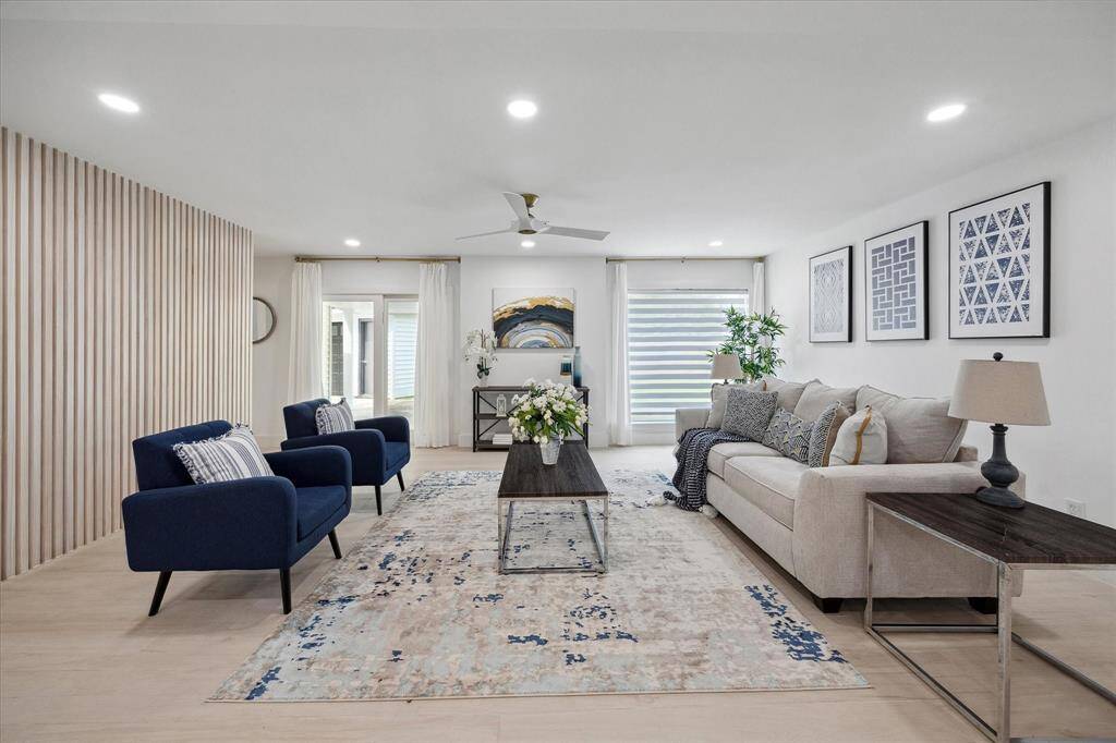 An upscale living room offers ample space for entertaining, with sophisticated touches throughout.