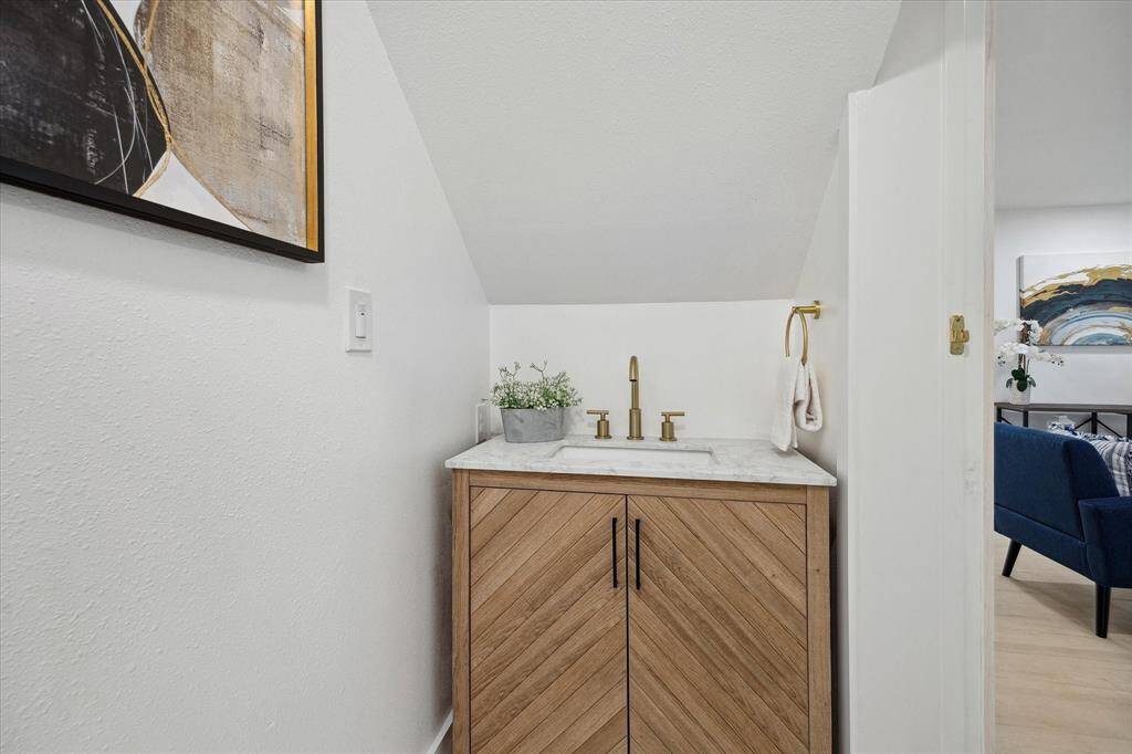A stylish half bath provides comfort and convenience for your guests.