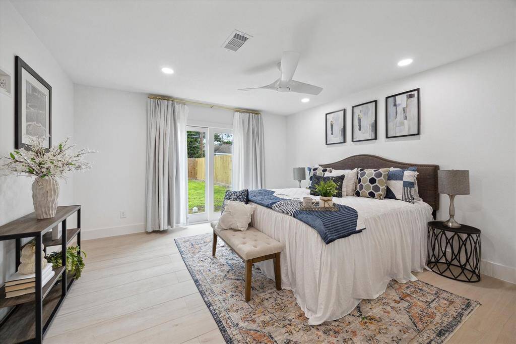 Retreat to the expansive primary bedroom, offering a peaceful and spacious escape.