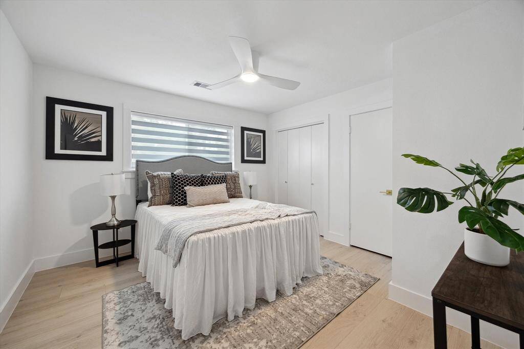 Another secondary bedroom bathed in natural light, making it feel bright and welcoming.