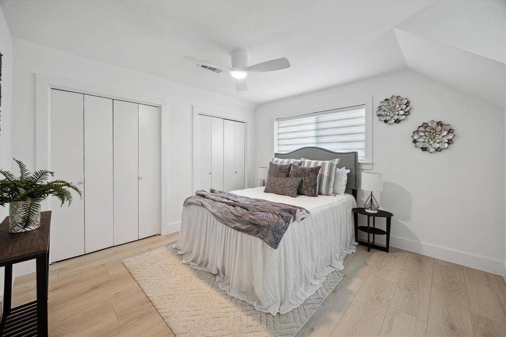 This additional bedroom features its own built-in desk, ideal for homework, hobbies, or remote work.