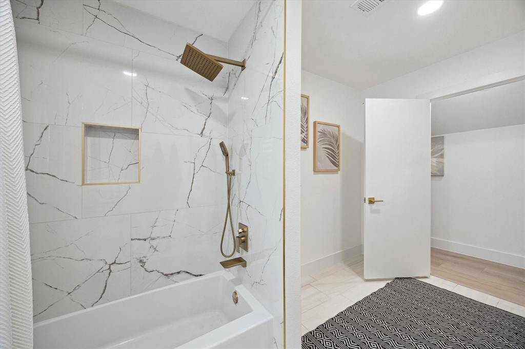 A tub and shower combo in the
