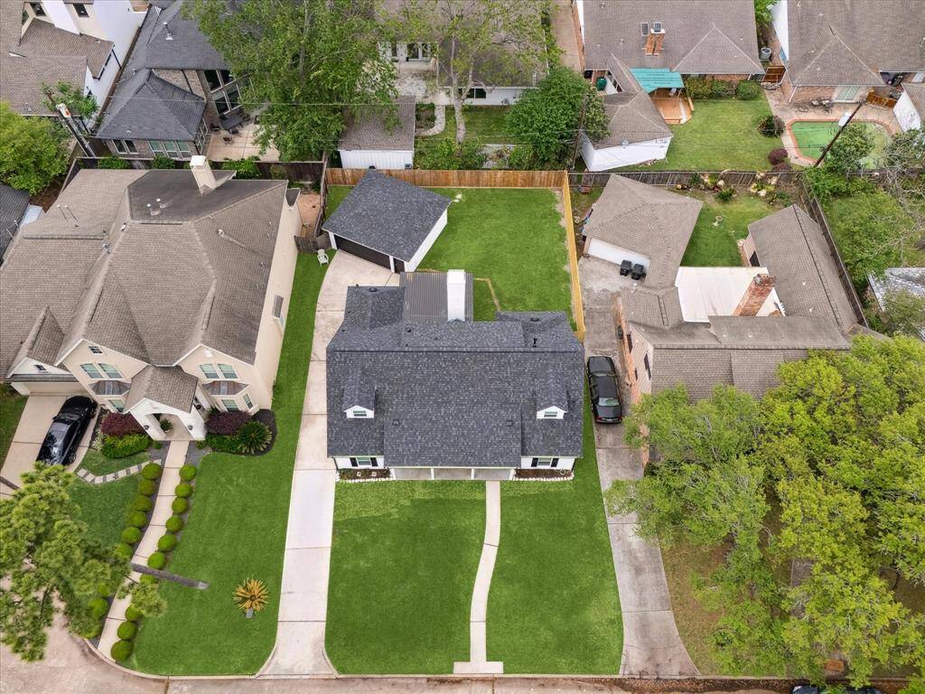 A stunning aerial view showcases your beautifully situated property in Memorial Meadow.