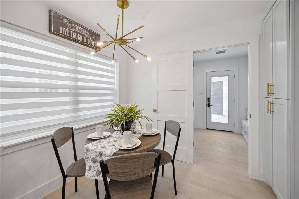 The cozy breakfast nook features a large picture window, making it the perfect spot to start your day.