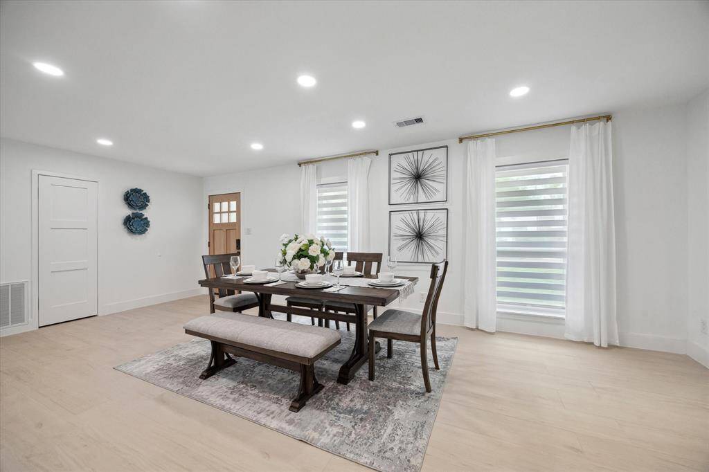 Host unforgettable dinners in the expansive formal dining room, highlighted by elegant recessed lighting.