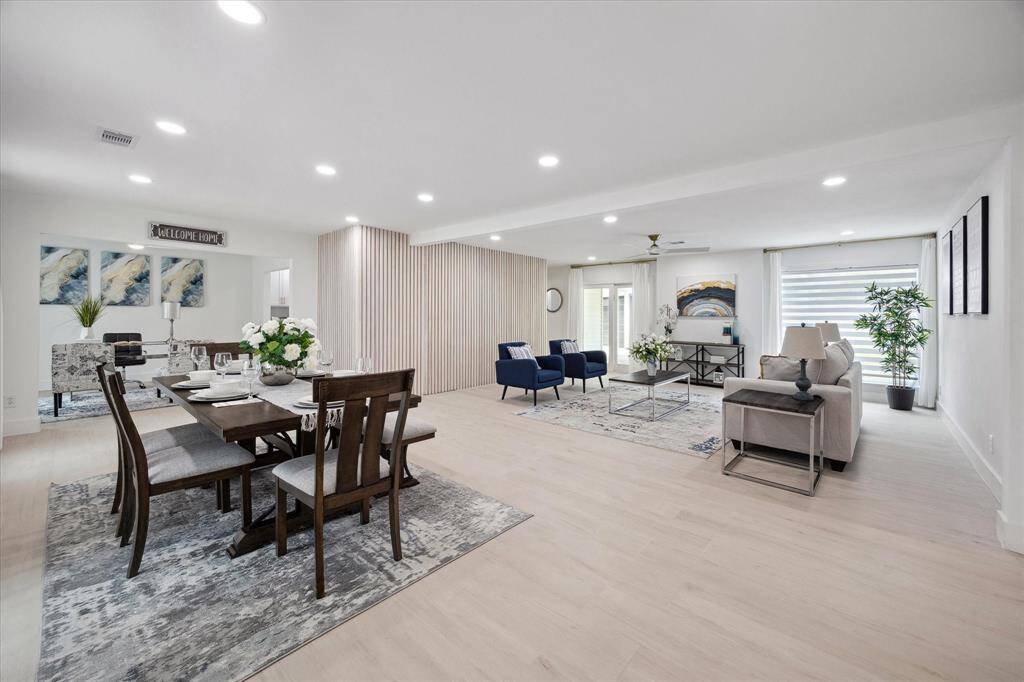 The open-concept floor plan blends living, dining, and kitchen spaces beautifully for effortless flow.