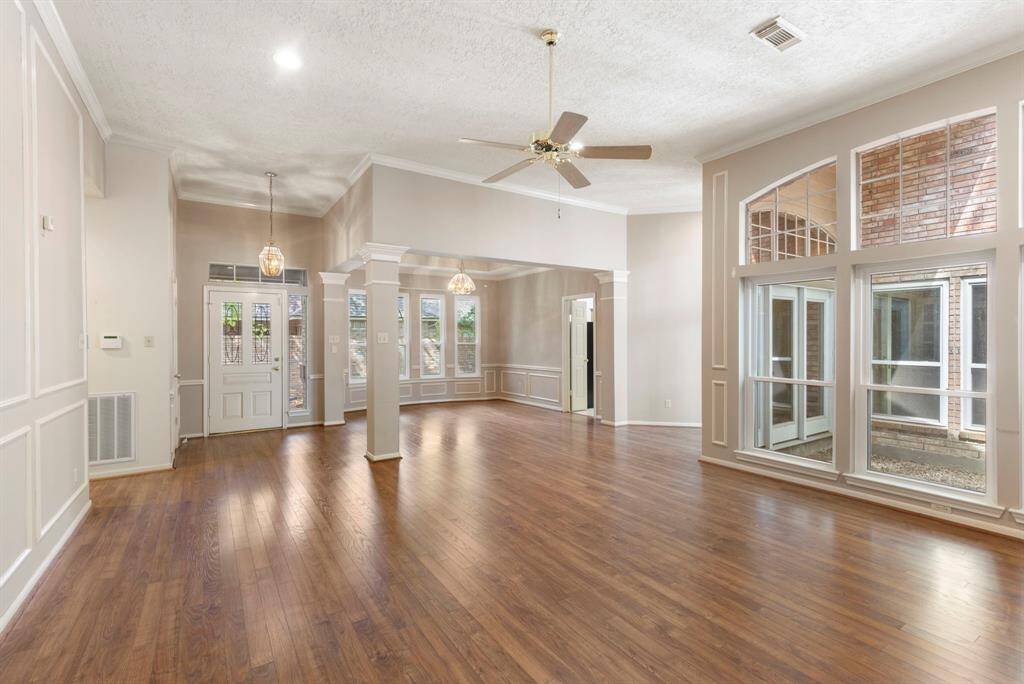 Expansive open layout with seamless transitions between living, dining, and kitchen spaces.