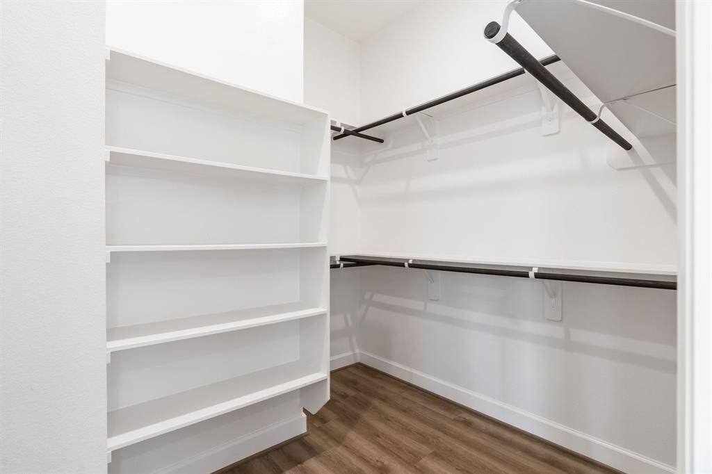 Large primary closet #1 with shelving.