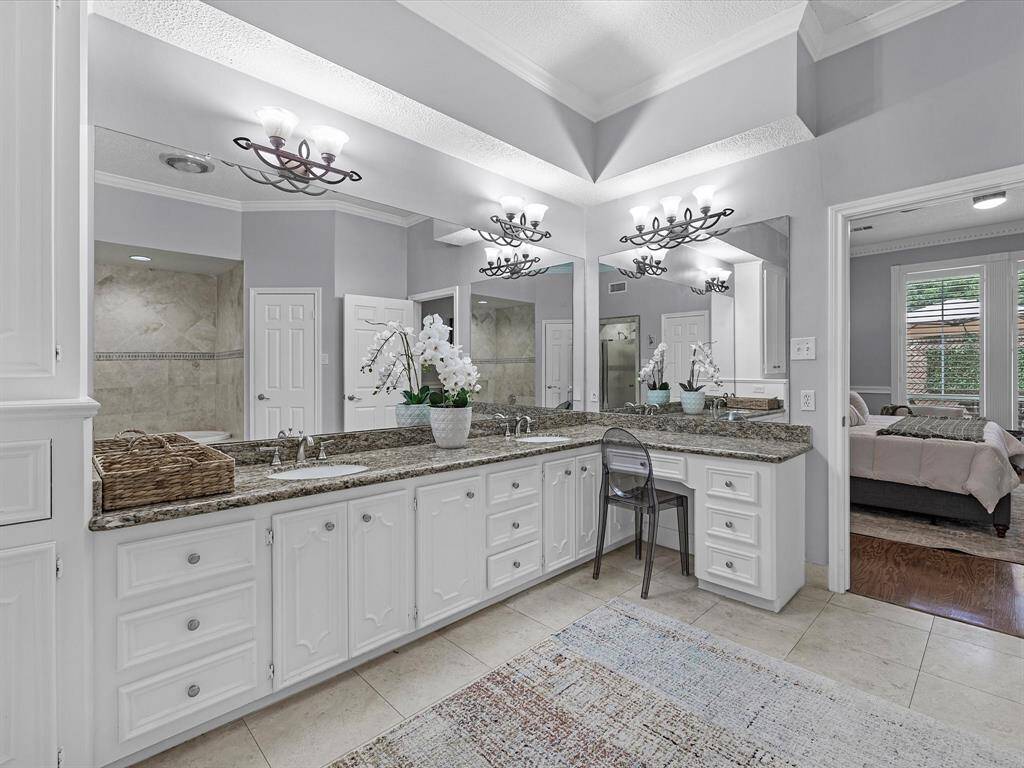 The Primary Retreat features a spa-like Bathroom with double sinks, vanity area and 2 closets.