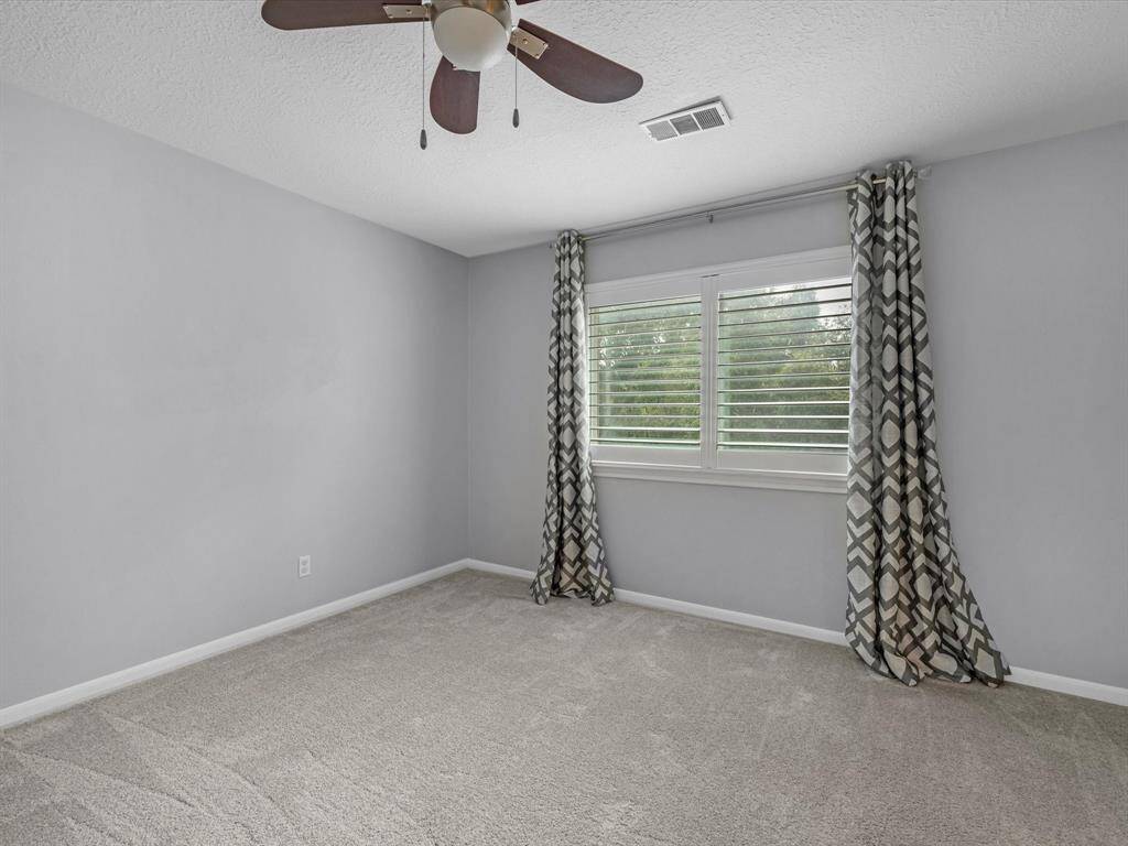 2 of 3 Secondary Bedrooms located upstairs with triple pane windows and plantation shutters.
