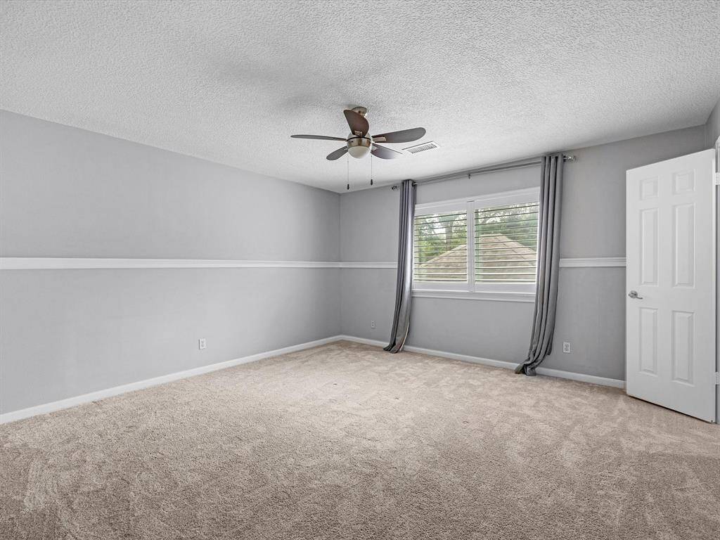 3 of 3 Secondary Bedrooms located upstairs with triple pane windows and plantation shutters.