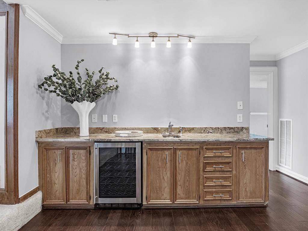 Alternate view of the Wet Bar off the Family Room with Wine Cooler, Sink and ample storage.