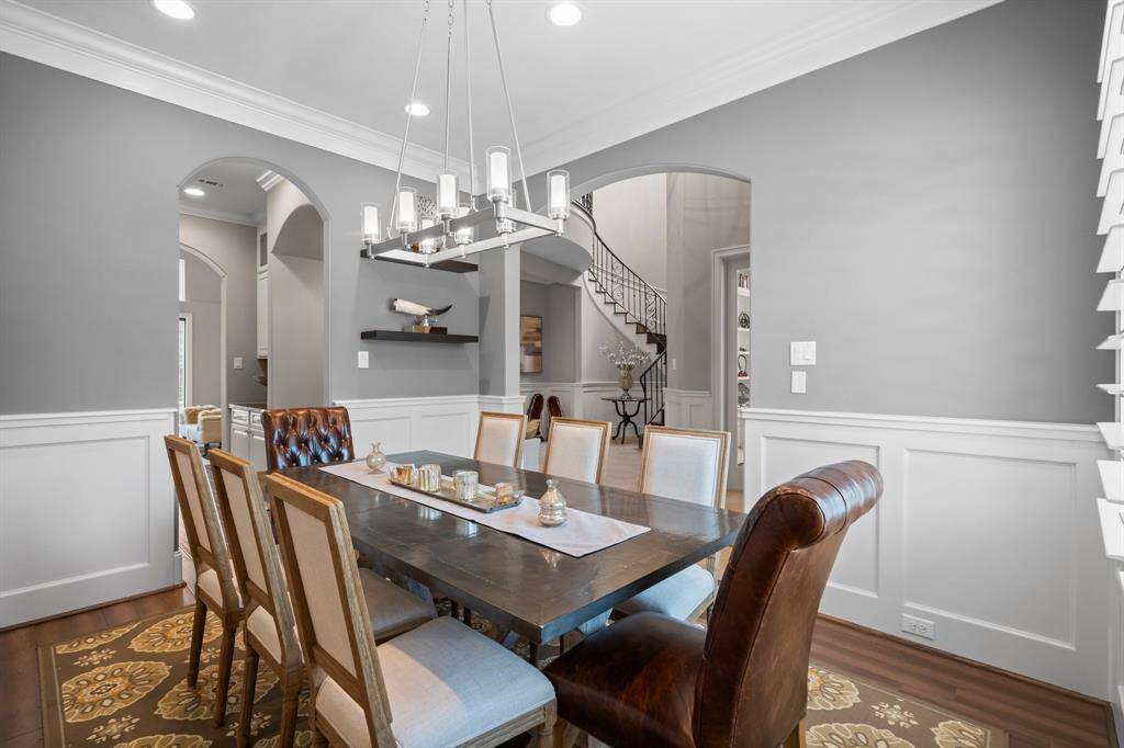 Dine in elegance in this stunning Formal Dining Room, where arched entryways and beautiful moldings create the perfect ambiance for entertaining. With plenty of space for a large dining table and full furniture suite, this room is perfect for any special occasion. Whether hosting a dinner party or enjoying a quiet meal, this space adds a touch of luxury to every occasion.