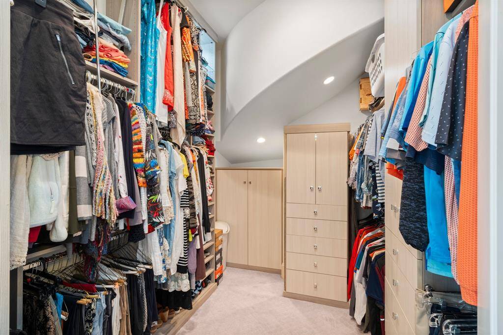 There’s no need to compromise on space with this custom walk-in closet in the Owner’s Suite. The California Closet system features custom built-in shelving, dressers, ample hanging space (including upper-level pull-down racks), and elegant upgrades such as belt and tie racks and a dedicated jewelry drawer with two shelves — offering the perfect blend of function and elegance. Thoughtfully designed to keep everything organized and beautifully displayed, these closets are a dream for anyone who values space.