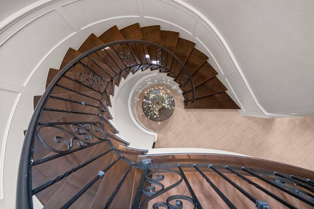 Ascend the elegant, winding staircase steeped in Southern charm to the second level, where you’ll discover three spacious bedrooms—each with its own private en-suite bath—along with a game room, media room, guest half bath, and a covered lanai for elevated outdoor relaxation.