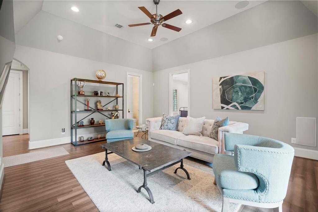 This versatile game room offers endless possibilities—whether you're envisioning a playroom, party space, or gaming hub. With plenty of room for gaming tables, toys, or entertaining, it’s ready to adapt to your lifestyle. A nearby hallway half bath adds extra convenience for guests. Don’t miss the virtual tour to truly experience this incredible space!