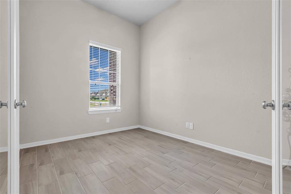 Located at the front of the house near the foyer, this versatile room can be used as a home office, sitting area, or playroom.