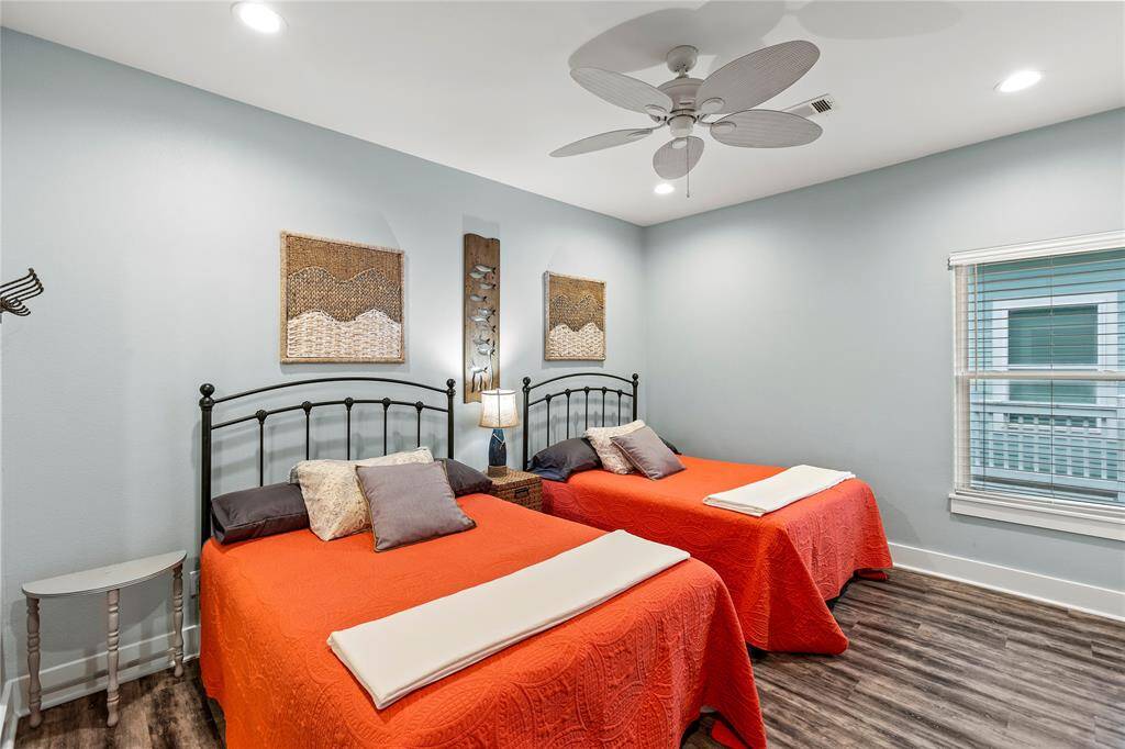 Bedroom 3: Bedroom is equipped with two full-sized beds and ceiling fan