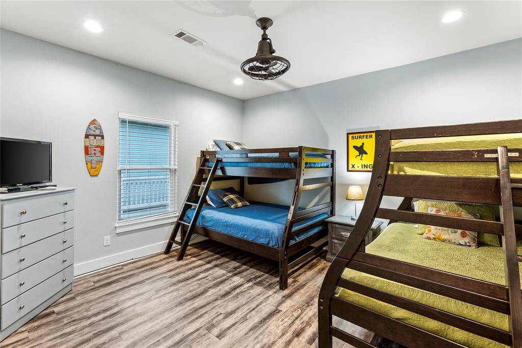 Bedroom 4: Bedroom has two twin-over-full bunkbeds and the room is equipped with a caged fan for safety as well as a TV