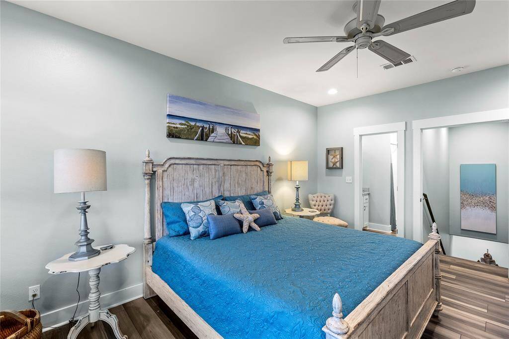 Bedroom 5: Upstairs, the primary bedroom is a private suite with GORGEOUS Gulf views