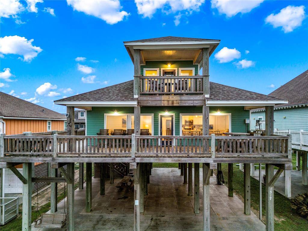 Row 2 beach house has oversized deck, 5 bedrooms, 3 bathrooms, and HUGE shaded area on the ground floor to entertain a crowd.