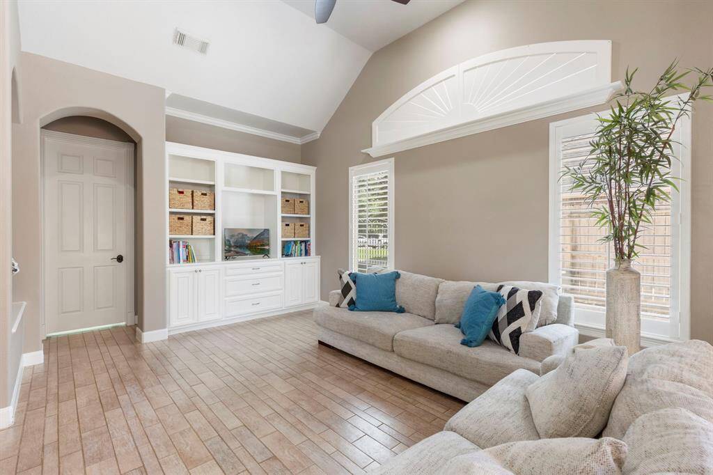 The kitchen overlooks this cozy family room.