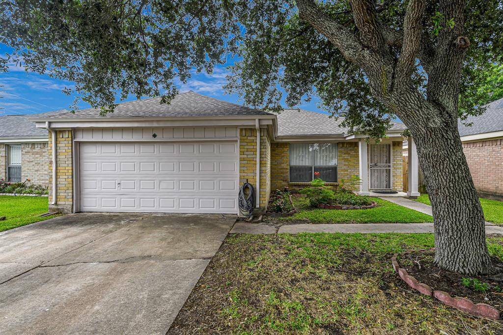 Front of Home with nice, mature tree.