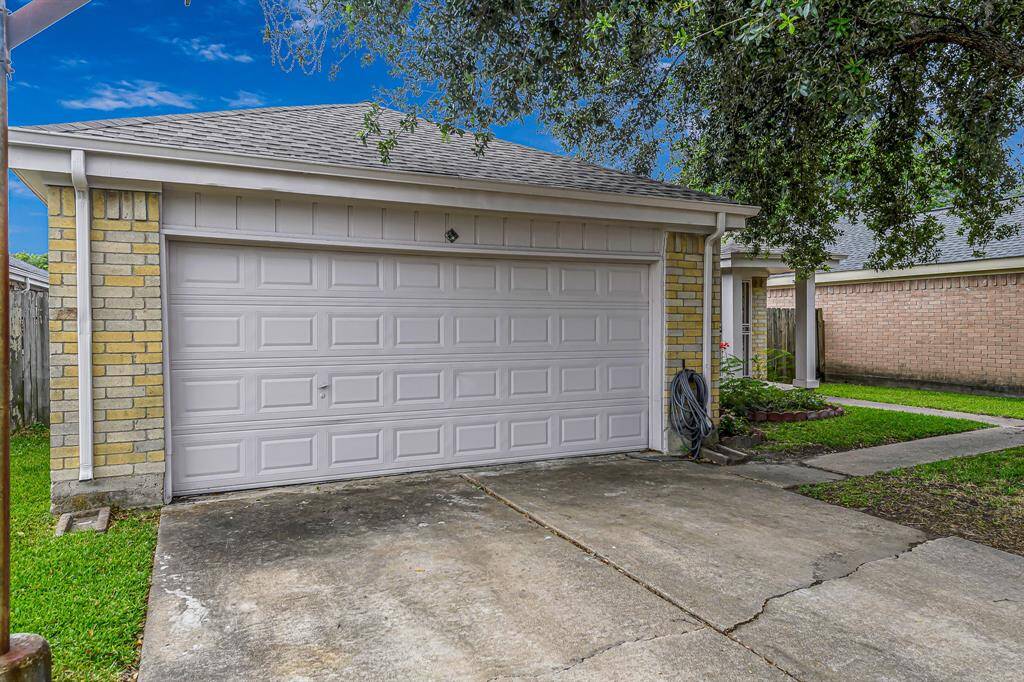 Double wide driveway and two car garage