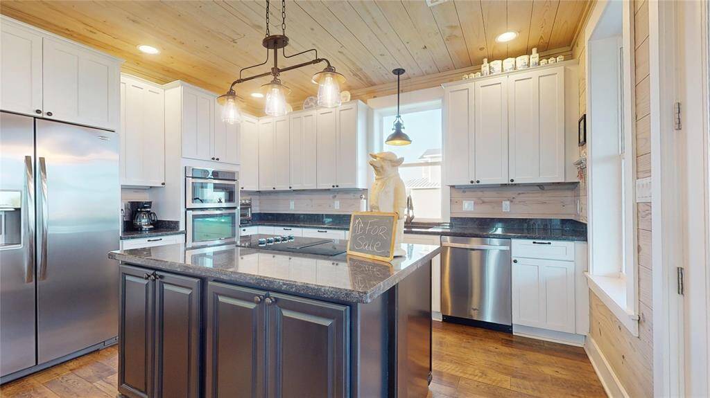 Light, bright, and matching stainless steel appliances that convey with the property!