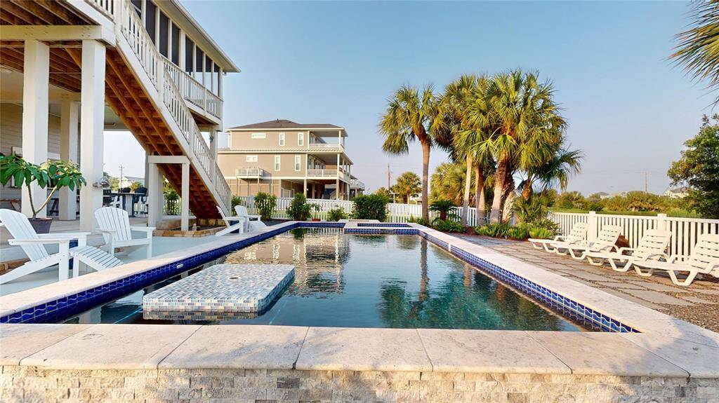 Modern, heated pool with attached hot tub and fire pit!
