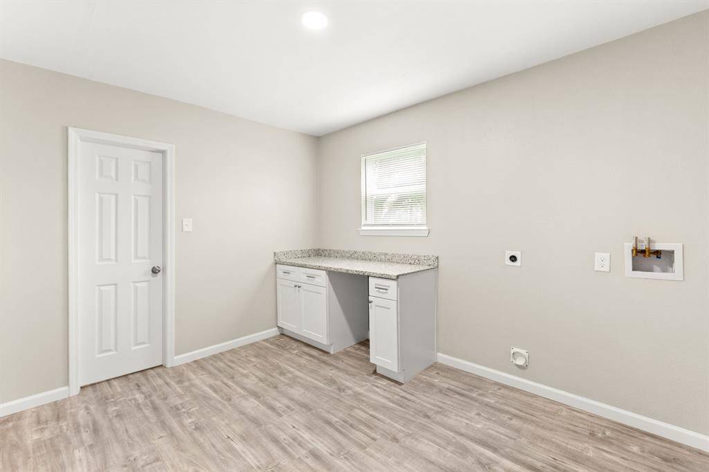 Spacious and versatile laundry/mudroom, perfect for organization and convenience