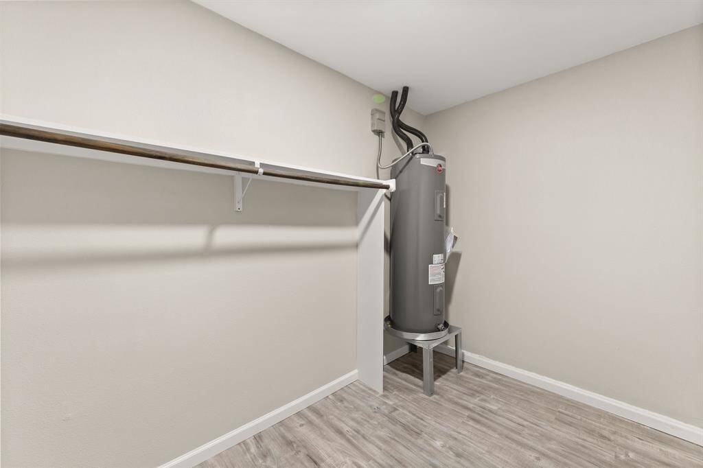 Convenient hanging space located directly aside from the laundry room for additional storage and hanging space