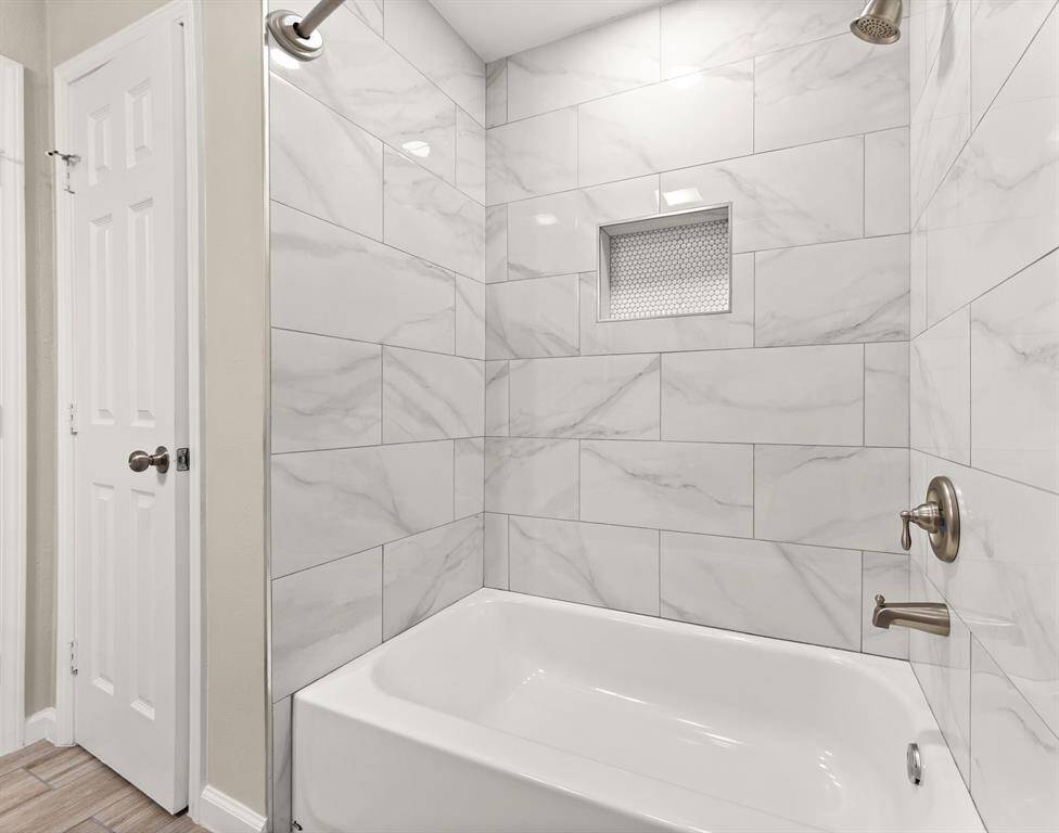 Elegant guest bathroom with modern tile, perfect for style and functionality