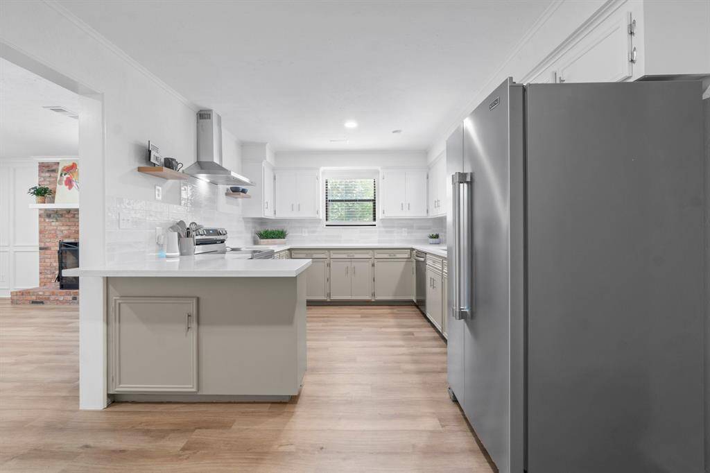 This kitchen is sure to be the heart of the home with brand new quartz countertops and appliances.