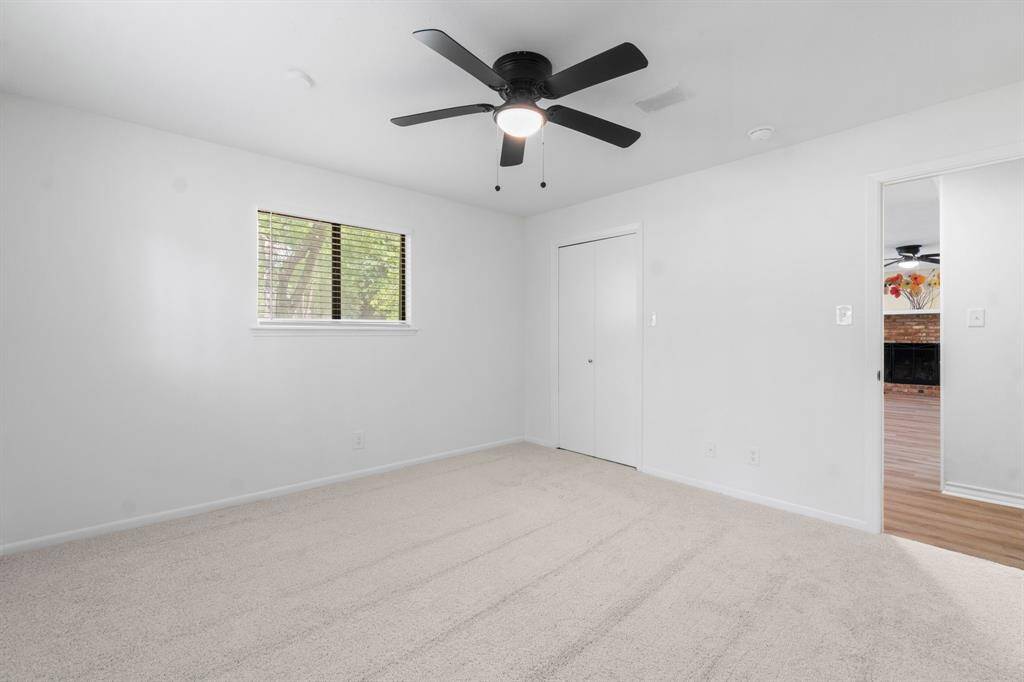 This secondary bedroom located at the front of the home has an en -suite bath and may also be used as the primary!