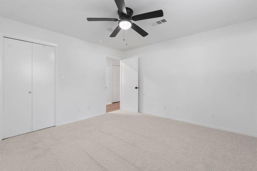 Brand new carpet, and ceiling fan.