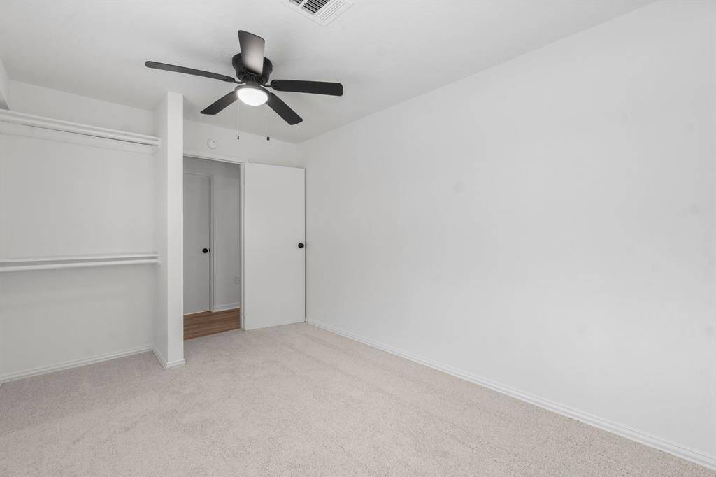 Secondary bedroom can also be used as an office space or workout room.