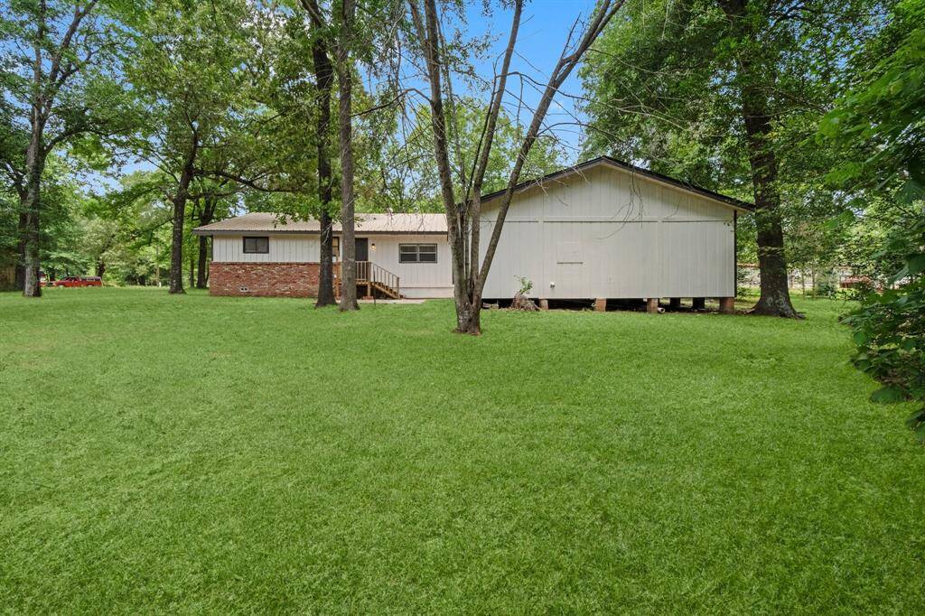 So much potential available for this spacious property. This yard has plenty of room for kids or pets to play.