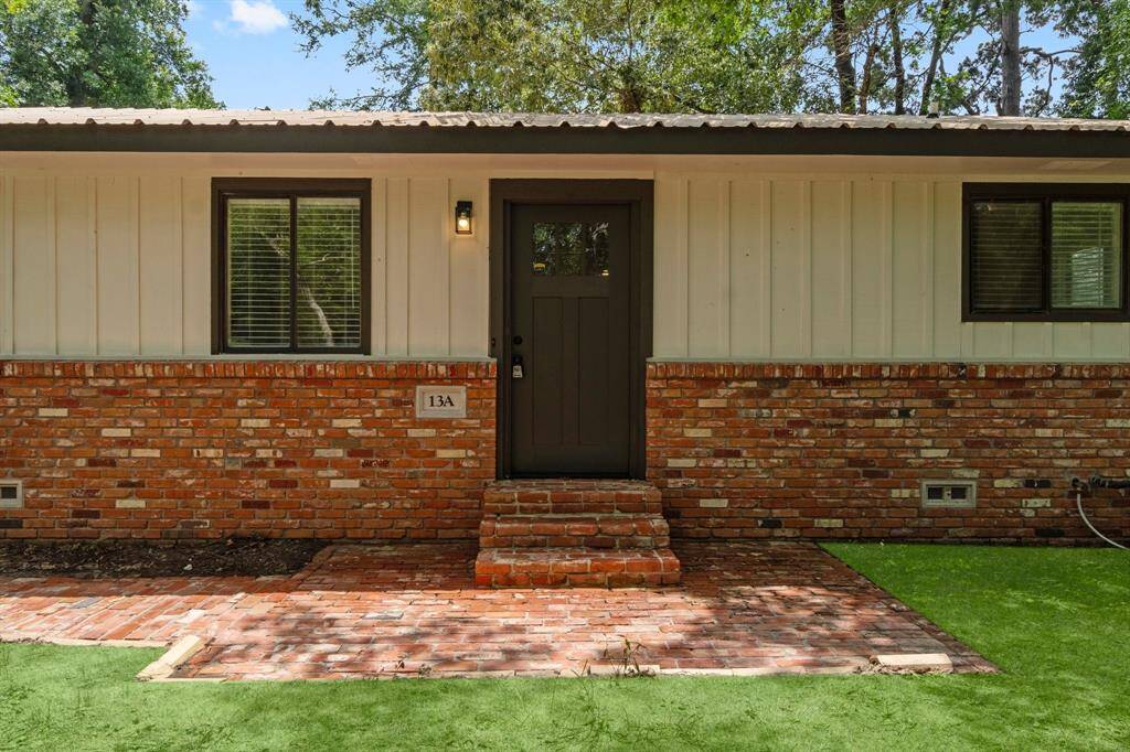 Freshly painted exterior with brick walkway welcomes you home.