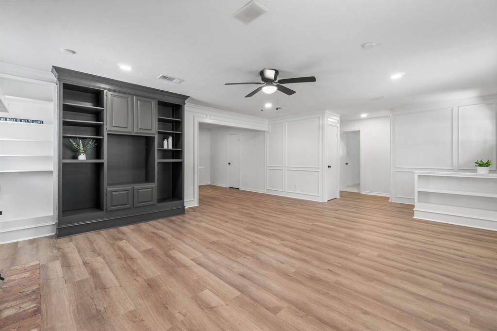 Enjoy the large built-in cabinets & additional shelving for displaying books, trinkets and more!