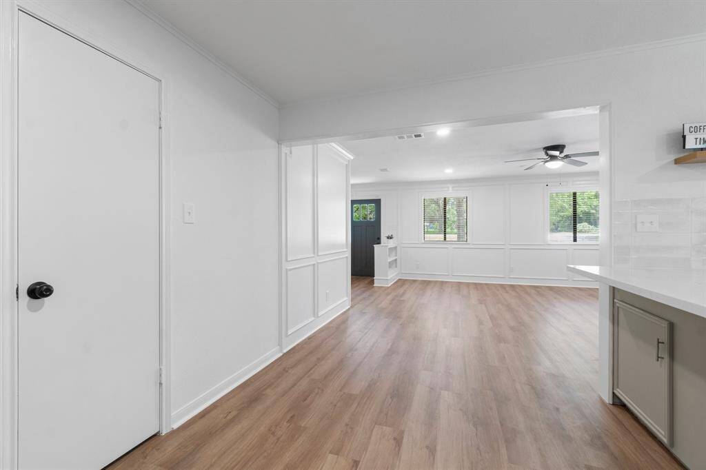 This space can easily fit a small table or leave this space open. Transitions right into the large living space and front entry.