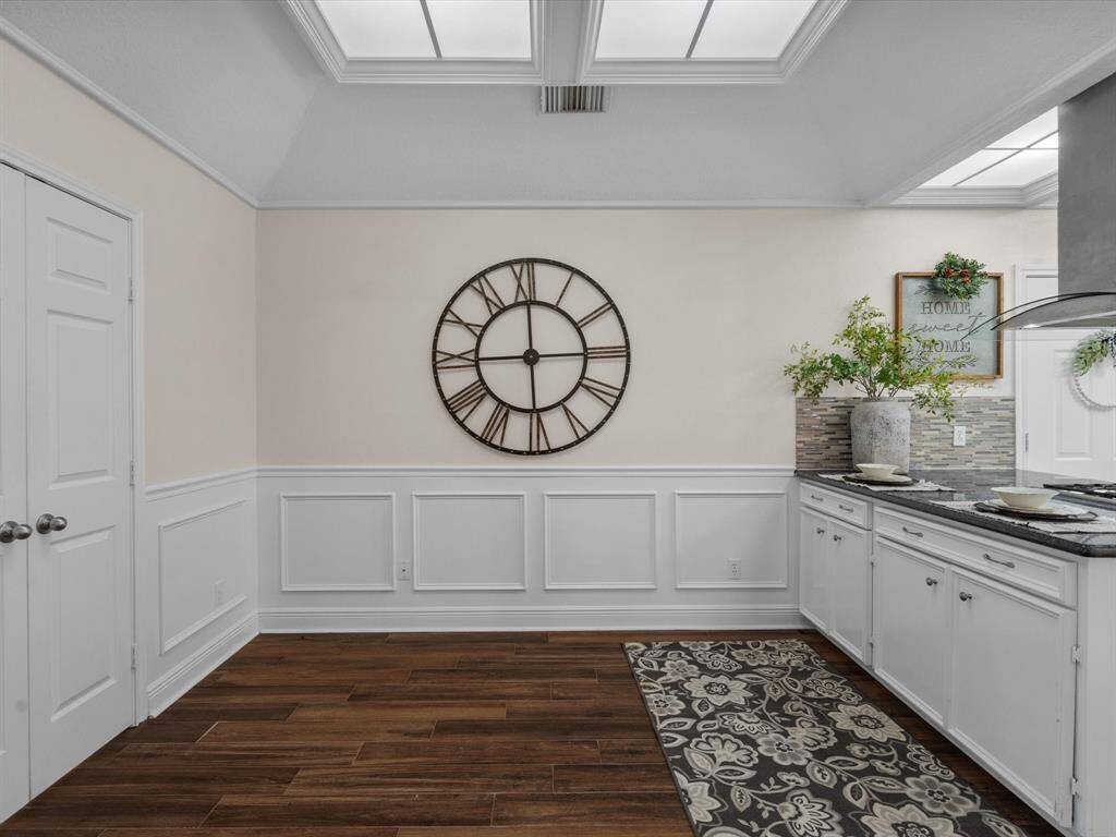 Breakfast area adjoining cook-top and granite counter, & glass like back splash