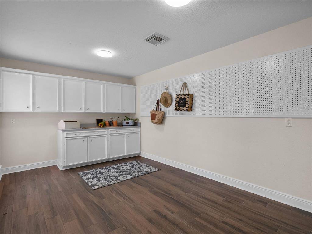 Flex room featuring much storage and lighting.