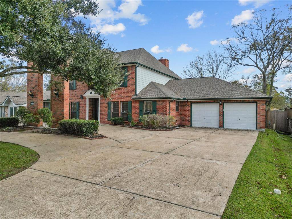 Mature trees, with lush landscaping, enhances the curb appeal of this beautiful home.