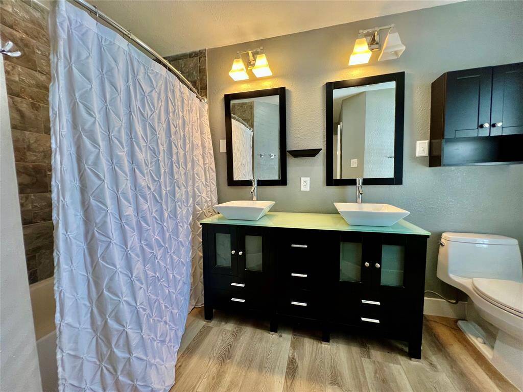 Updated primary bath with double-vanity.