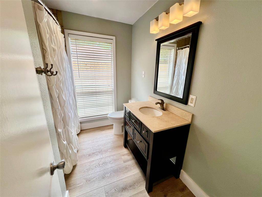 Guest bathroom completely updated hardware, lighting and fixtures.