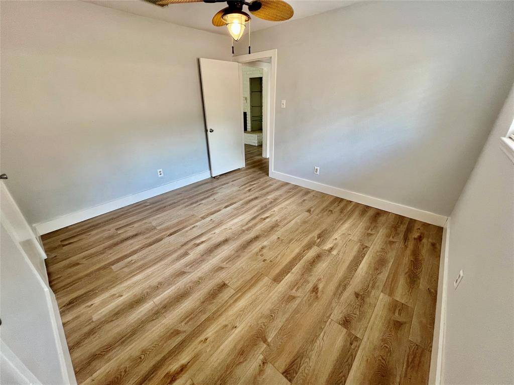 Alternate view of guest bedroom 2 with updated ceiling fan and double closets.