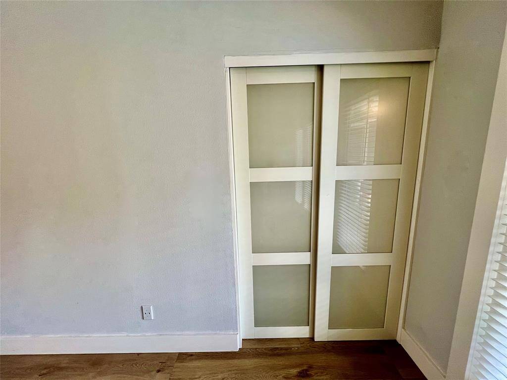 Study entrance with frosted, sliding doors.